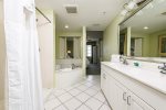 Master bath with double sinks and a large walk in shower